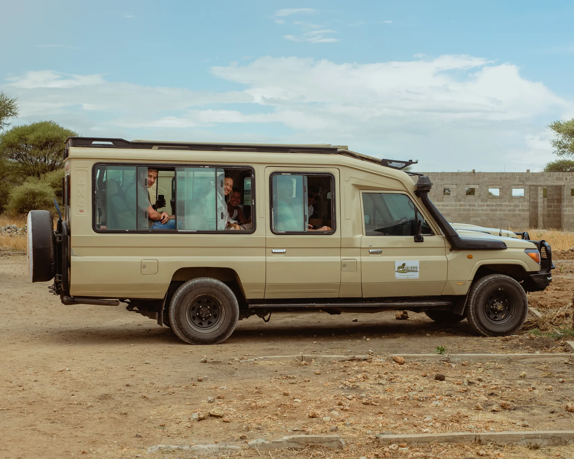 Safari vehicle travelling through a Tanzania wildlife area
